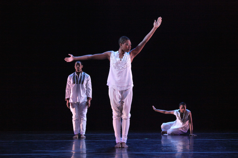 Keon Tholouis and Clarice Young (seated) flank Brionna Edmundson with arms outstretched in The Subtle One. Photo: Ayodele Casel.